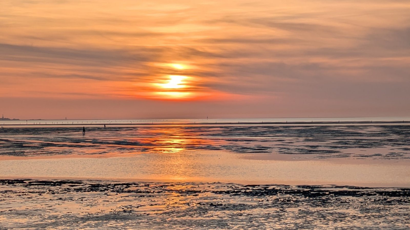 Sonnenuntergang über dem Watt bei Duhnen